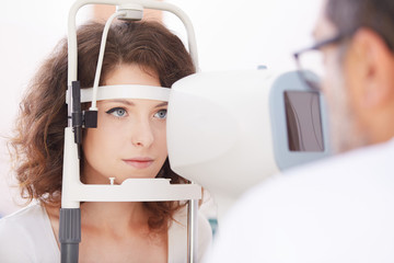 Optometrist doing sight testing for patient