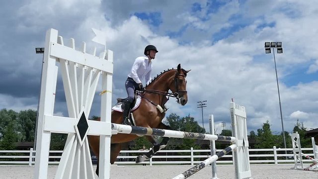 The man jumping over the barrier at the arena