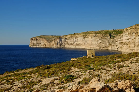 The Watchtower on the sandstone cliffs at Xlendi bay on the Island of Gozo, Malta.
