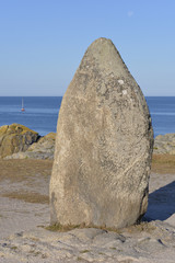 Closeup of menhir of the long stone ( Menhir de la pierre longue in French) on the wild coast of Le...