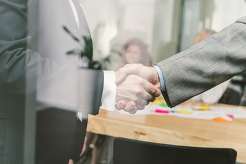Business handshake in a office