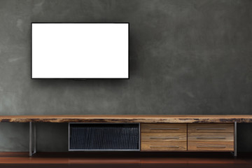 led tv on concrete wall with wooden media furniture