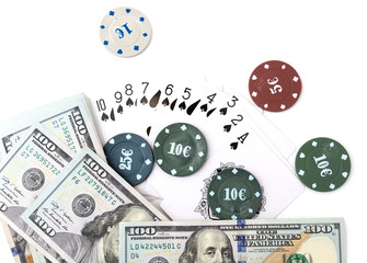 casino chips and cards and one hundred dollars on a white background