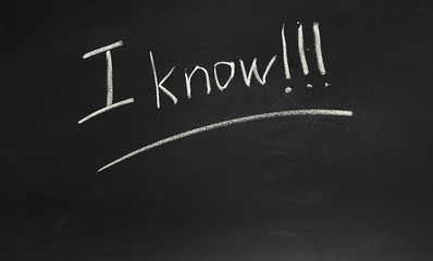 Obraz premium The school or university blackboard with threadbare chalk with an inscription I know