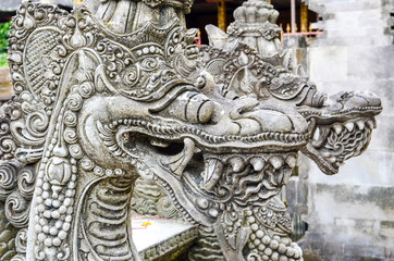 Fototapeta na wymiar Close-Up of the Guardian Sculpture at Tirta Empul Temple in Bali