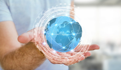 Businessman using digital tactile world interface with his hand