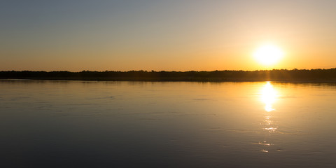 Naklejka premium a beautiful sunset on the river