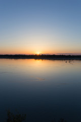a beautiful sunset on the river