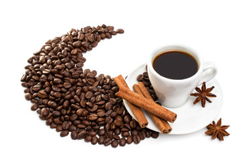 cup of coffee with cinnamon sticks, anise and chocolate