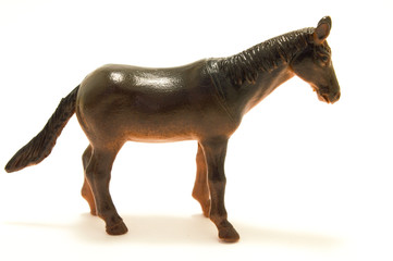 Toy plastic horse on the white background.
