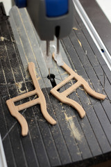 Electric fretsaw and part of handmade wooden toy