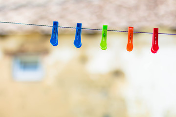 colored clothespins on blurred background