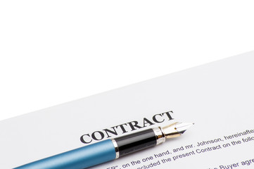 Close-up of pen on contract