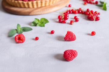 fresh raspberries and red currants and cake