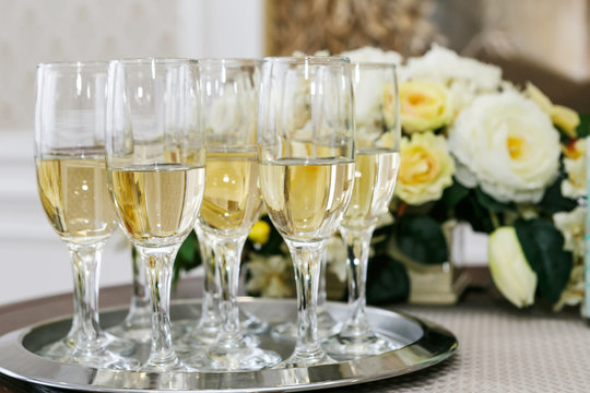 many of the champagne glasses on the table