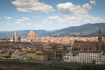 Magnificent view over the historical center of Florence in Italy. The photo is taken from piazzale Michelangelo and shows the Arno river, the Duomo and many other churches and buildings
