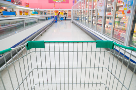 Abstract Blurred Photo Of Store With Trolley In Supermarket Stor