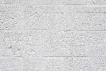 Close up of grey white background of weathered concrete cement bricks wall with empty copy space