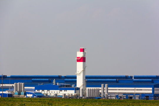 steel mill through the sultry summer air. Abinsk Electrometallurgical plant
