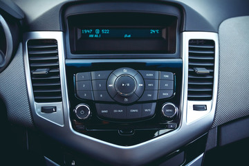 Car dashboard. Radio closeup. Modern CD player