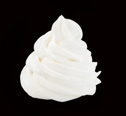 Whipped cream isolated on a black background with clipping path. Front view.