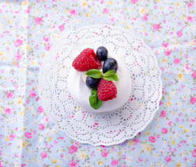 Homemade pavlova meringue cake with fresh berries and whipped cream. Morning. Dessert. Top view.