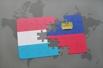 puzzle with the national flag of luxembourg and liechtenstein on a world map background.