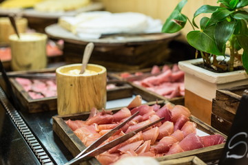  Brunch buffet with spanish jamon close up. Ham in Spanish style served at  the bruch 
