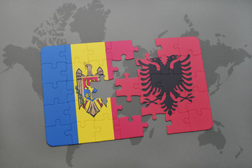 puzzle with the national flag of moldova and albania on a world map background.
