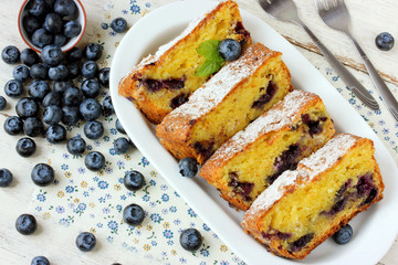 Summer pastries: muffin with fresh blueberries on a light table