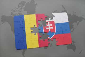 puzzle with the national flag of romania and slovakia on a world map background.