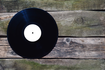 old vinyl record with white label on the old vintage floor