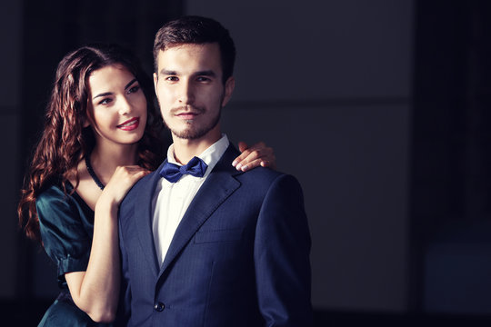 Elegant couple on dark background