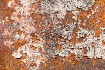 A background of peeling paint and rusty old metal