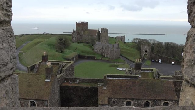 Dover medieval Church from Castle window ferry. Founded in the 11th century defensive significance and the largest castle in England. Roman lighthouse and fortification.