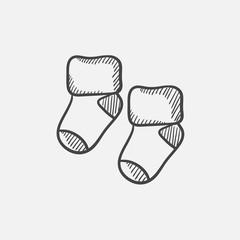 Baby socks sketch icon.