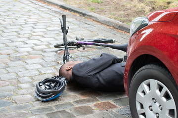Cyclist Lying On Street After Accident
