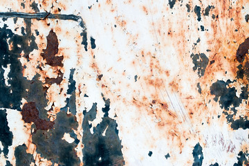 A background of peeling paint and rusty old metal