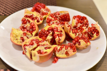 Close-Up of Red Pomegranates on a White Plate