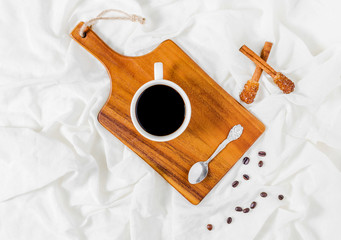 Naklejka premium Having a cup of coffee in bed