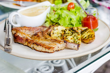 Pork chop with fried potatoes