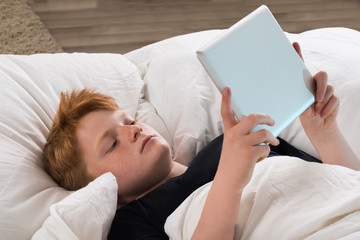 Boy Holding Digital Tablet