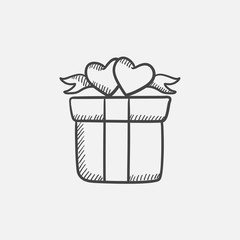 Gift box with hearts sketch icon.