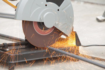 Close up of rebar being cut at a construction site. Short trail