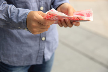 hands counting chinese cny cash on street