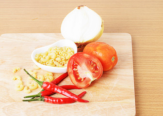 Close uo of tomatoes, red pepper, Onion, Macaroni for clean food