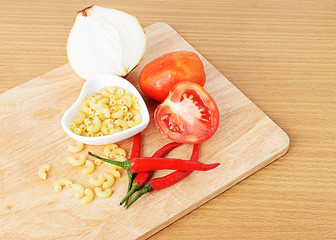 Fresh tomatoes and red pepper, Onion and macaroni heart shape cu