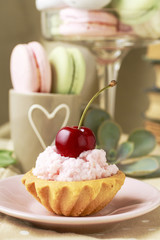Cupcake decorated with fresh cherry