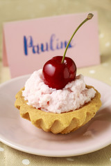 Cupcake decorated with fresh cherry