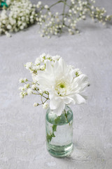 Tiny bouquet with gypsophila paniculata and dahlia flower.